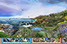 A 36' photocomposite illustration of California landscapes and plants from the ocean to the mountains, day to night. Embeded in the landscape ar